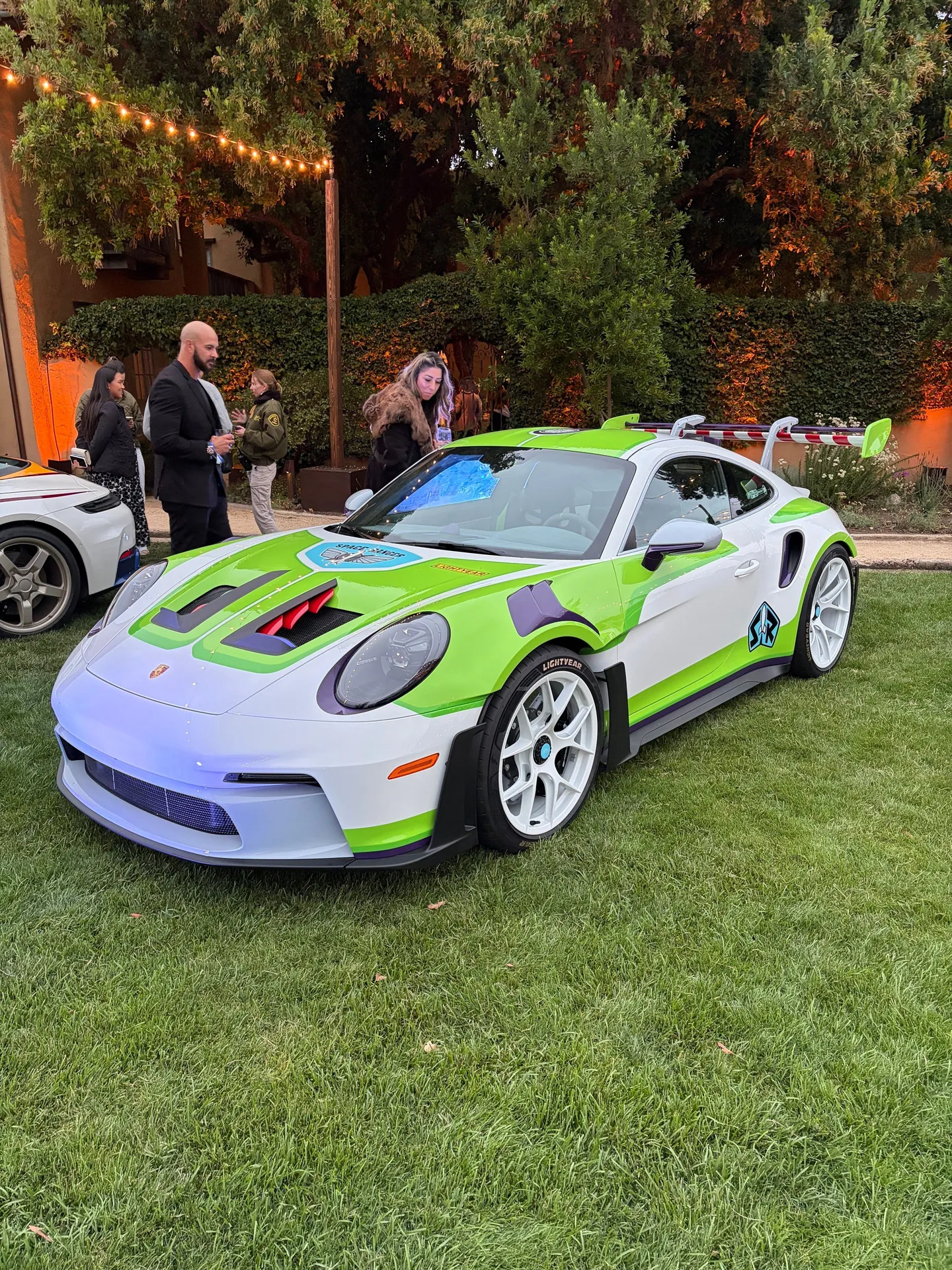 Green, white, and purple Buzz Lightyear-themed Porsche